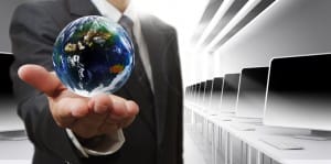 Business man hand holds globe